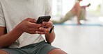 Hands, phone and person in yoga club for social media, chat or text after training closeup. Smartphone, app and athlete at a sports centre online for blog, post or contact, gif or web communication