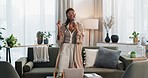 Happy woman, phone and singing or dancing in living room enjoying holiday or weekend at home. Female person with mobile smartphone in karaoke, sound track or listening to music in lounge at house