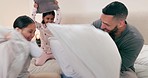 Dad, bed and pillow fight with children for love, laughter and weekend together to support with care. Mexican, happy family and father with girl kids in bedroom, relax games and excited and comedy