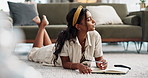 Woman, thinking and writing in journal on living room floor, inspiration and agenda with gen z style, idea and brainstorm. Young, indian person or mindfulness by notepad, pen and creative planning