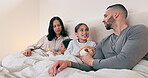 Parents, children and teddy with communication for happy family in morning, together and love with care at house. Mom, dad and girl kids in bedroom with conversation to relax and smile at home
 
 