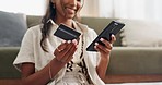 Woman, hands and phone with credit card for payment, online shopping or transaction in living room at home. Closeup of female person on mobile smartphone with debit for purchase, buying or ecommerce