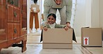 Moving, father and child with box, playing and happy with real estate, love and adventure in family home. Property, dad and daughter with fun, smile and energy on floor in new house with freedom.