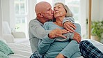 Elderly couple, hug and kiss in bedroom, care and conversation together at home. Love, senior man and happy woman in bed, embrace and connection for support, relationship and commitment to marriage