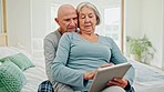 Senior couple on bed with tablet, hug and smile checking social media, funny meme and relax in home. Digital app, old man and woman in bedroom streaming fun video together with love, marriage or care