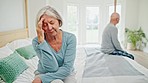 Senior couple, divorce and conflict on bed in fight, disagreement or dispute at home. Frustrated elderly woman in cheating affair, headache or disappointment in bedroom argument or toxic relationship