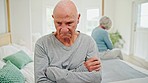 Senior couple, divorce and breakup on bed in conflict, disagreement or fight at home. Frustrated elderly man in cheating affair, divorce or disappointment in bedroom argument or toxic relationship