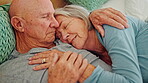 Elderly, hug and happy couple in bed, talking and embrace together in home. Love, senior man and woman in bedroom for connection, support and healthy relationship, romance and relax in retirement