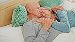 Senior, hug and happy couple in bed, sleeping and embrace together in home. Love, elderly man and woman in bedroom for connection, support and healthy relationship, romance and relax in retirement