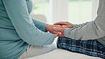 Senior couple holding hands in home for support, care and empathy after cancer diagnosis. Closeup, elderly man comfort woman and love, kindness and connection, trust partner and hope together on bed