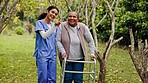 Retirement, old woman with walker and nurse in garden in support, help or trust at happy nursing home. Senior care, elderly person and caregiver walk with frame together with smile, trees and grass.