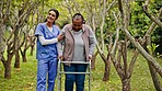 Senior care, old woman with walker and nurse in park with support, help or trust with trees. Happiness, retirement and healthcare, elderly person and caregiver walking in garden together with smile.