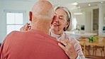 Senior couple, dancing and smile in home with love, romance or bonding for wellness in retirement. Happy elderly woman, old man and together in kitchen for steps, moving and holding hands in house