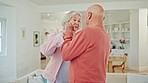 Senior couple, dancing and home with love, support and care together in retirement with marriage. Happy, smile and relax with a woman and man together with fun in a living room with embrace and music