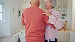 Senior couple, dancing and marriage with retirement, care and love in a living room with music. Smile, hug and support of an elderly woman and man together with fun, solidarity and fun in a house