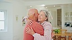 Senior couple, hug and home with love, support and care together in retirement with marriage. Lounge, smile and relax with a woman and calm man together with rest in a living room with embrace