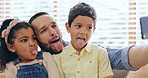 Happy family, tongue out or father take a selfie with kids on sofa to relax on social media together for memory. Love, smile or dad taking picture or photograph with funny children siblings in home