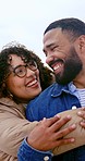 Happy, love and excited couple hug outdoor in celebration of travel, freedom or adventure together. Smile, face and woman embrace man outside with support, trust or care, security or romantic journey