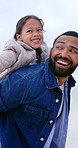 Beach, piggy back and father with child for bonding, relationship and flying to relax in nature. Ocean, travel and happy dad with girl on holiday, vacation and weekend for playing, fun and adventure