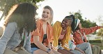 Laughing, talking or friends in park on holiday vacation for bonding or speaking together in summer. Happy, smile or funny gen z group of people outdoors in USA with freedom, diversity or wellness 