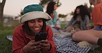 Picnic, phone chat or girl in in park on social media, internet post or mobile app notification to relax. Friends, happy or gen z woman in nature for texting, networking or typing in online dating