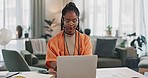 Black woman, typing in home office and laptop for remote work, social media or blog research in apartment. Freelance girl at desk with computer writing email, website post and online chat in house.