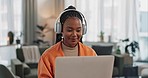 Laptop, headphones and young woman in living room listening to music, playlist or album in modern apartment. Technology, smile and young African person streaming song on computer in lounge at home.