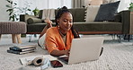 Laptop, education and a student black woman on the floor of a living room to study for a test or exam. Computer, smile and a happy young person learning with an online course for upskill development