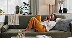 Phone call, laugh and black woman on sofa for talking, funny conversation and online discussion. Networking, communication and person relax on smartphone with humor, joke and comedy chat in home