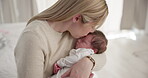 Family, kiss and a mama rocking her baby to sleep in the bedroom of their home together for love or care. Dreaming, nap or tired with a parent and newborn infant in an apartment to rest for growth