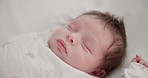 Baby, sleeping youth and nursery bed with morning, nap and dreaming of a young newborn at home. Cozy, sleepy kid and calm with health development from rest and peace in a house with closeup and care