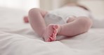 Sleeping, family and feet of baby on bed for child care, dreaming and relax in nursery. Adorable, cute and closeup of toes of innocent newborn infant for health, wellness and development at home