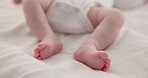 Sleeping, adorable and feet of baby on bed for child care, dreaming and relax in nursery. Family, cute and closeup of toes of innocent newborn infant for health, wellness and development at home