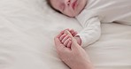 Bed, holding hands or mother with infant, love and support for care, health or wellness at home. Fingers, family or mama with a healthy baby, protection or child development with bonding or maternity