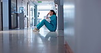 Nurse, stress and sad on floor for hospital mistake, healthcare fail or bad news of clinic death. Mental health of medical worker, tired woman or doctor with depression, anxiety or fatigue for crisis