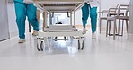 People, doctor and legs running with stretcher for emergency, ICU or quick surgery to save a life at hospital. Closeup of medical group or shoes in rush with bed for healthcare, urgency or support