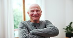 Senior man, smile and arms crossed for happiness, home and elderly for retirement, happy and positive. Face, pensioner and confident for portrait, casual and alone in old age home, friendly and relax