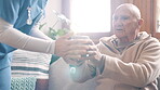 Nurse, senior man and help with coffee in home living room in the morning, support and lens flare on sofa. Caregiver, elderly person and tea service, drink in hands and blowing hot espresso in cup