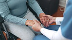 Nurse, holding hands and support patient in wheelchair, trust and medical help, empathy and kindness. Closeup, caregiver comfort senior woman with a disability and cancer, healthcare or hope in home