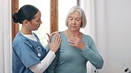 Physiotherapist, patient and examination for health in clinic for shoulder, injury or pain. Elderly woman, talking or consultation with medical professional for rehabilitation, care or retirement