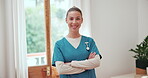 Woman, arms crossed and face of nurse working in living room of nursing home. Happy, caregiver and portrait with confident healthcare worker with pride for career in retirement care service or house