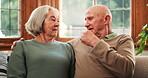 Elderly, couple and communication in care on sofa, marriage and love with support in living room. Senior man, woman and talking with relax, retirement freedom and memory together in happy family home