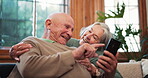 Relax, online and senior couple on sofa with phone, app or streaming a video on social media with internet. Reading, cellphone and people in retirement with funny meme or scroll news in living room