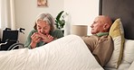 Bed, sick and senior couple holding hands for support, bonding and compassion at home together. Retirement home, marriage and elderly man and woman in bedroom for illness, healing and recovery