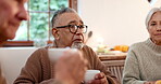 Tea party, old friends and conversation with people in a retirement home together for bonding in the morning. Diversity, drink and a group of seniors talking in an apartment living room to relax