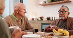 Tea party, senior friends and conversation with pensioners in a retirement home together for bonding in the morning. Diversity, drink and a group of elderly people in the living room of an apartment