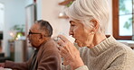 Tea party, elderly friends and conversation with an old woman in a retirement home for bonding in the morning. Smile, drink and a group of happy senior people in the living room of an apartment