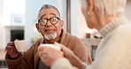 Tea party, friends and conversation with a senior man in a retirement home together for bonding in the morning. Smile, drink and group of happy old people chatting in the living room of an apartment