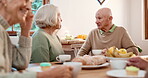 Breakfast, elderly friends and conversation with people in a retirement home together for bonding in the morning. Tea party, drink and a group of seniors chatting in the living room of an apartment