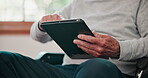 Senior, hands and man with tablet on internet for social media, web scroll or communication in living room. Elderly, person and touchscreen for digital search, reading news or information in lounge